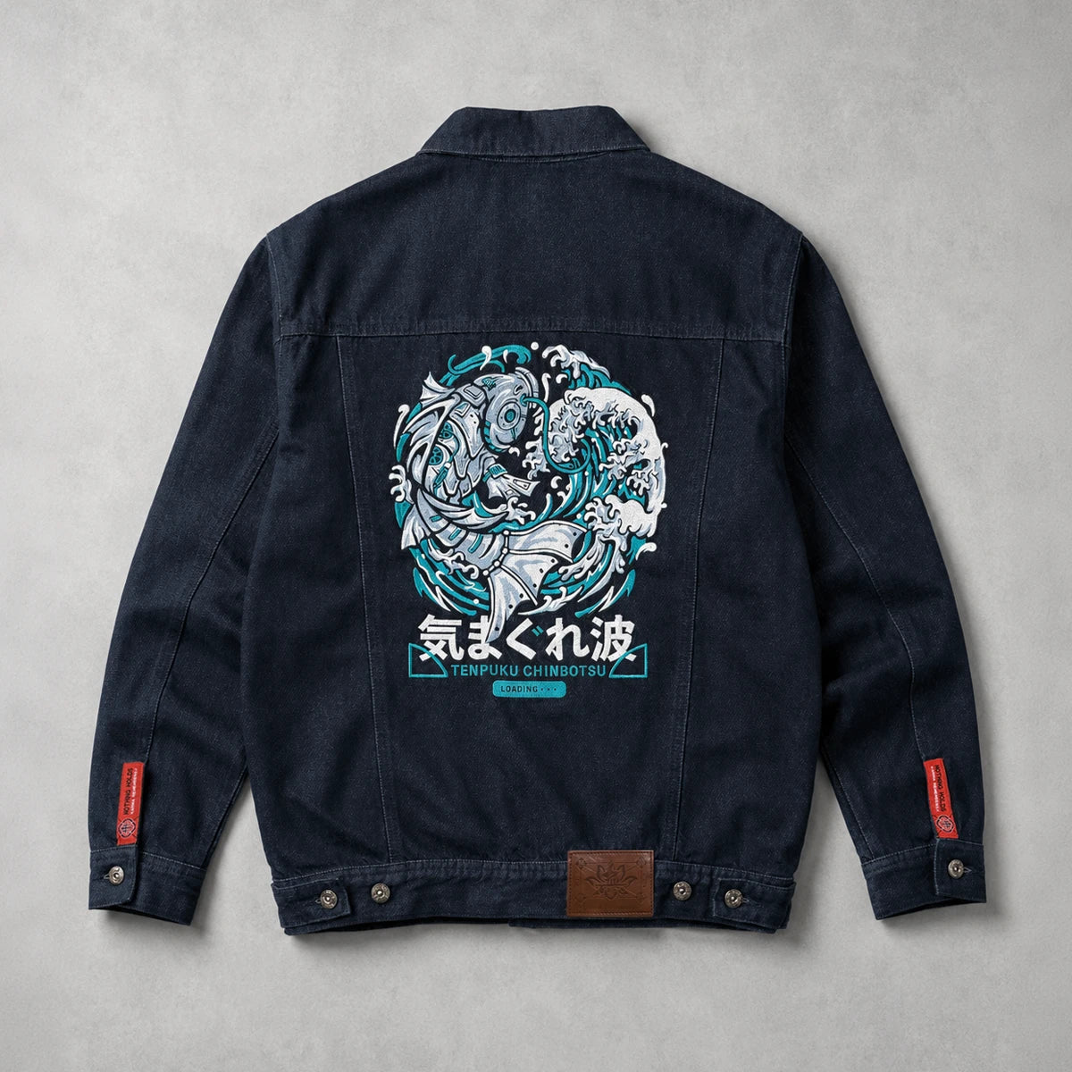 Rogue Wave denim jacket shown from the back with oversized Japanese wave embroidery.
