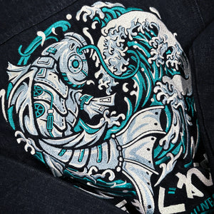 Close-up of the Rogue Wave denim jacket featuring detailed Japanese wave embroidery.