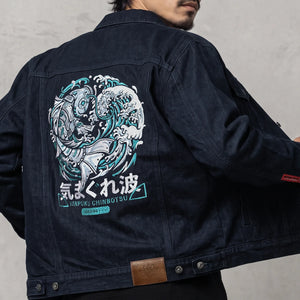 Model wearing the Rogue Wave denim jacket from the back, featuring oversized Japanese wave embroidery.