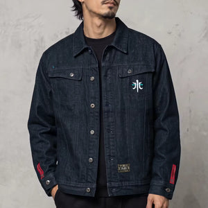 Model wearing the Rogue Wave denim jacket from the front, showing the heavyweight indigo denim and chest embroidery.
