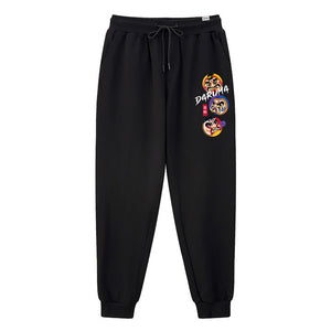Daruma - A Japanese style black sweatpants featuring the design of Japanese daruma, printed on the left.