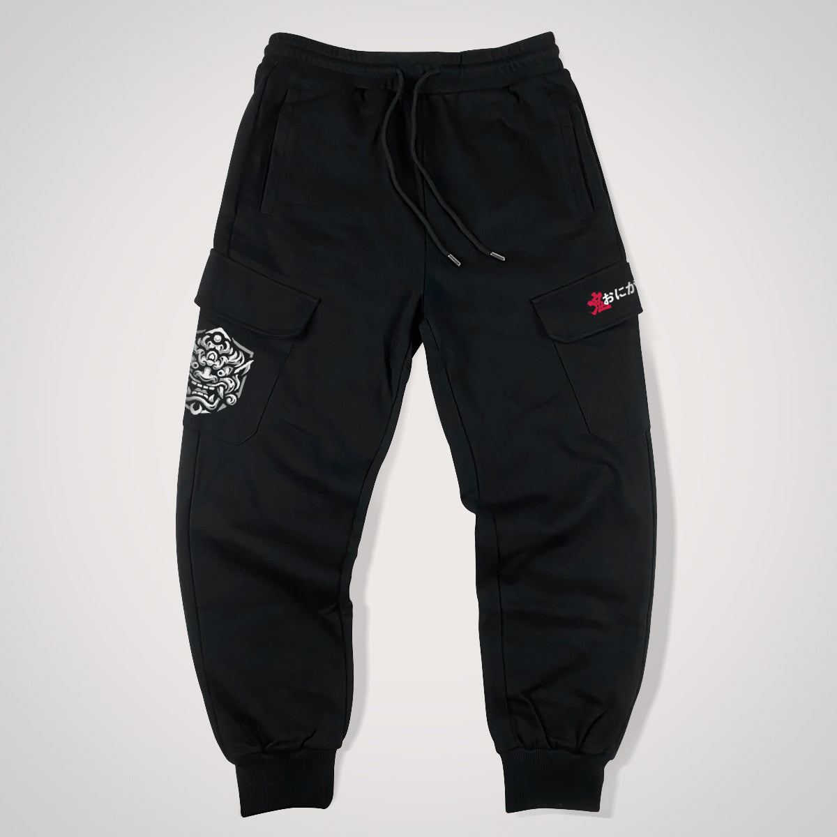 Onigawara - a Japanese style black flap pocket pants with original design printed on the two pockets- front view