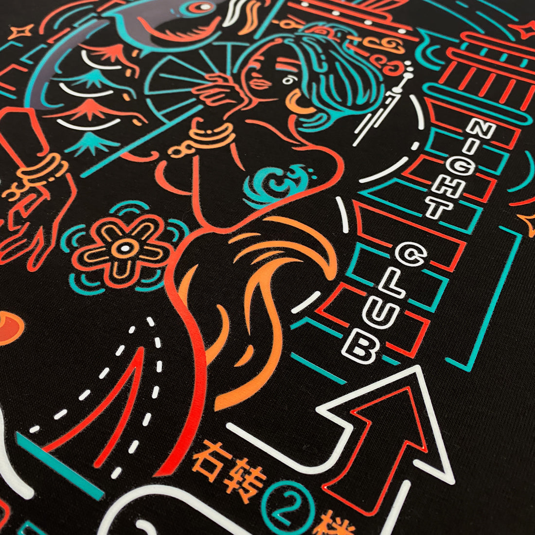 Neon - a close-up of featuring the graphic design inspired by vintage Shanghai neon lights, printed on the front of a Japanese style black heavyweight T-shirt-2