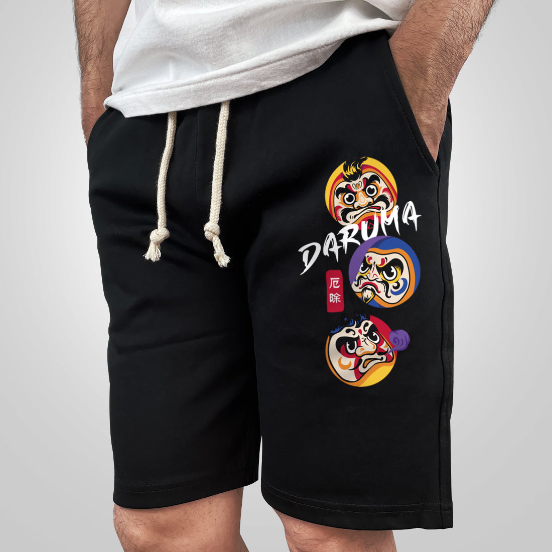 Daruma - a model wearing a black shorts, the Japanese daruma design printed on the left.