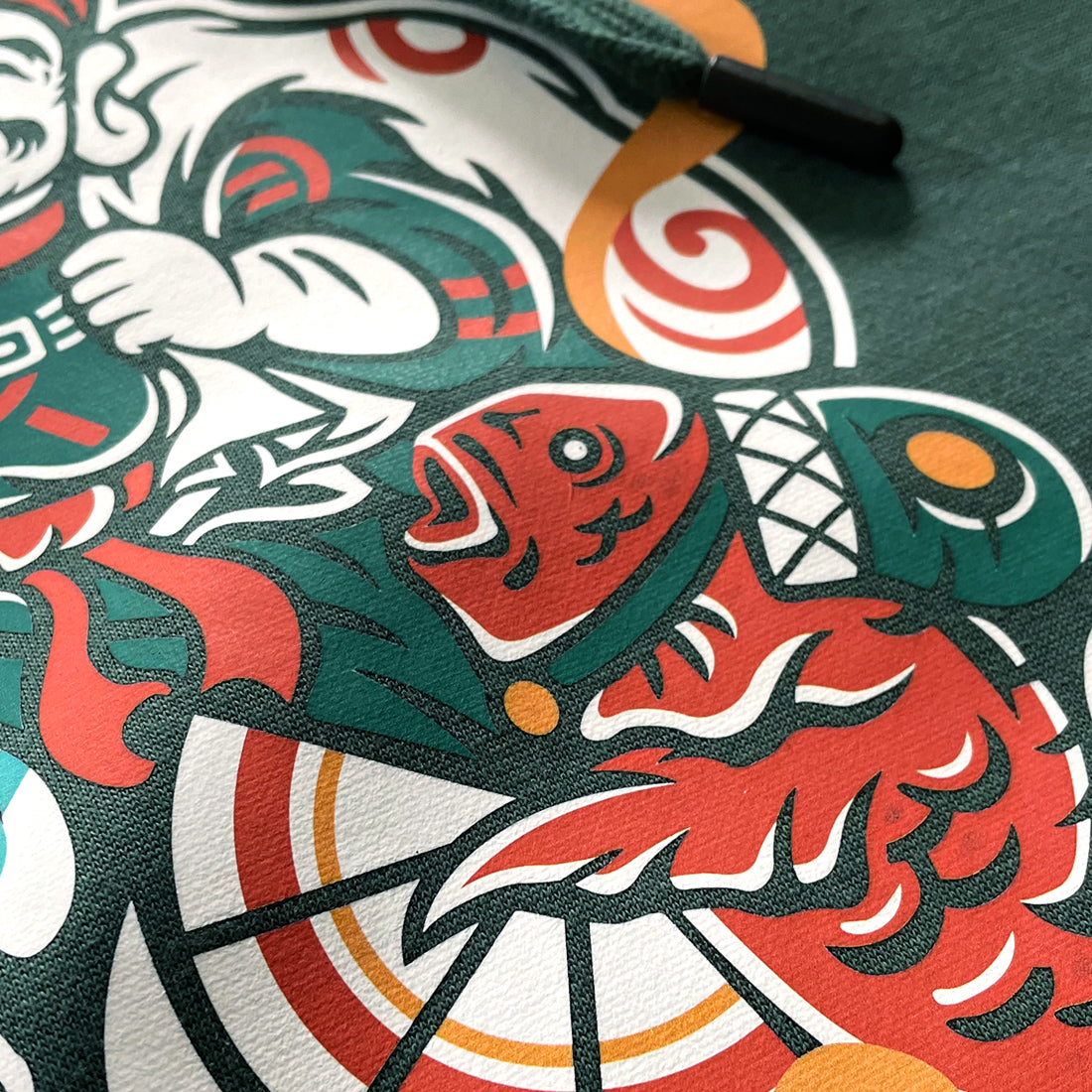 Ebisu - a close-up of the Ebisu graphic design printed on the front of the Japanese style dark green hoodie-2