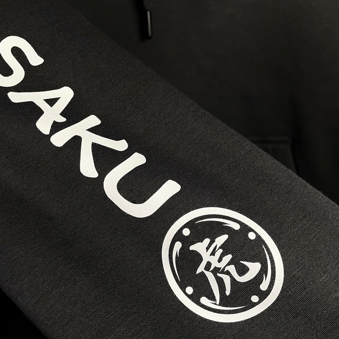 The tiger  - a close-up of the graphic design on a Japanese style black hoodie sleeves