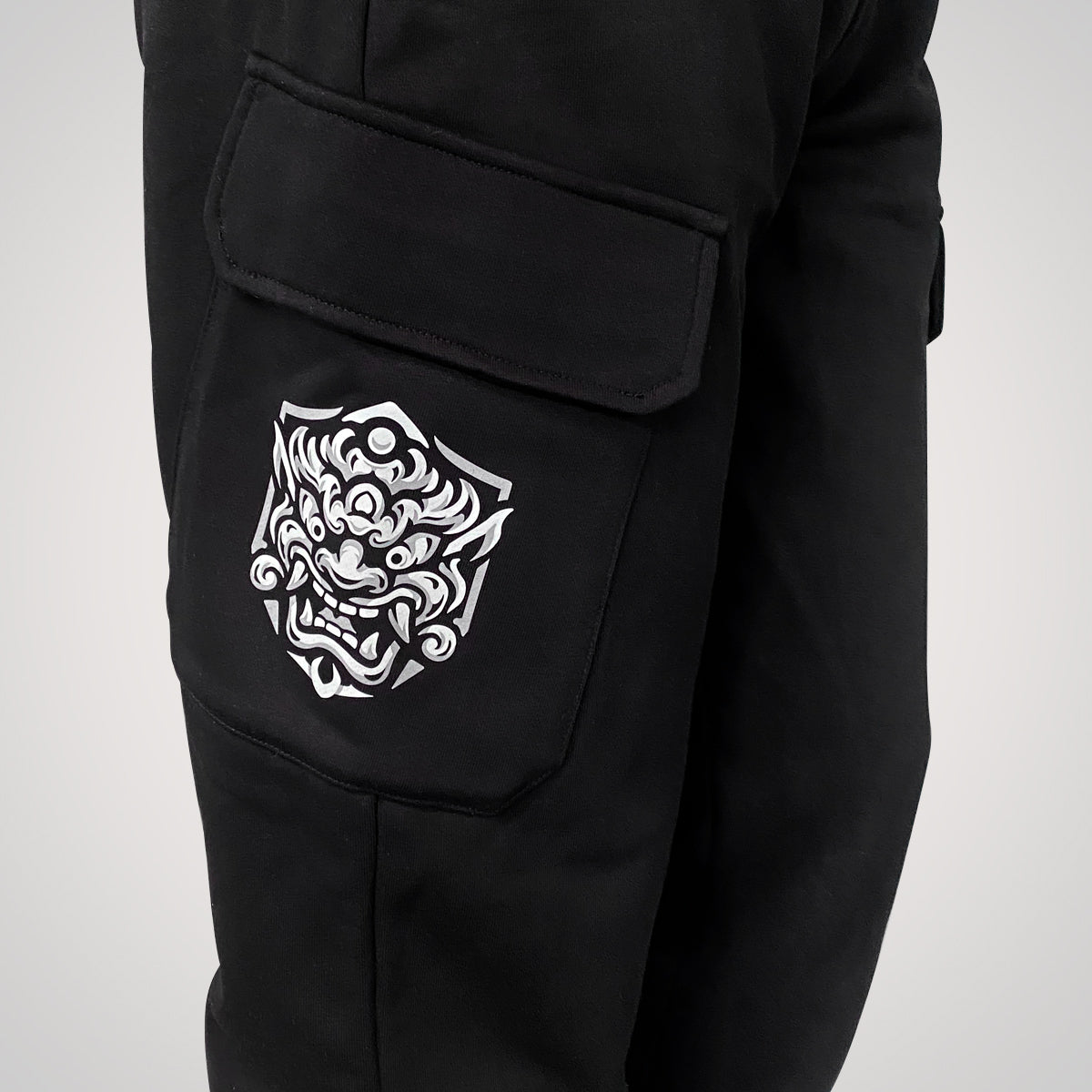 Onigawara - a Japanese style black flap pocket pants with original design printed on the two pockets- right side view