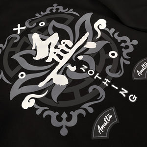 Emptiness - a close-up of the design with a background of religious patterns, overlaid with the Chinese character WU (meaning emptiness) , printed on the back of the black sweatshirt.