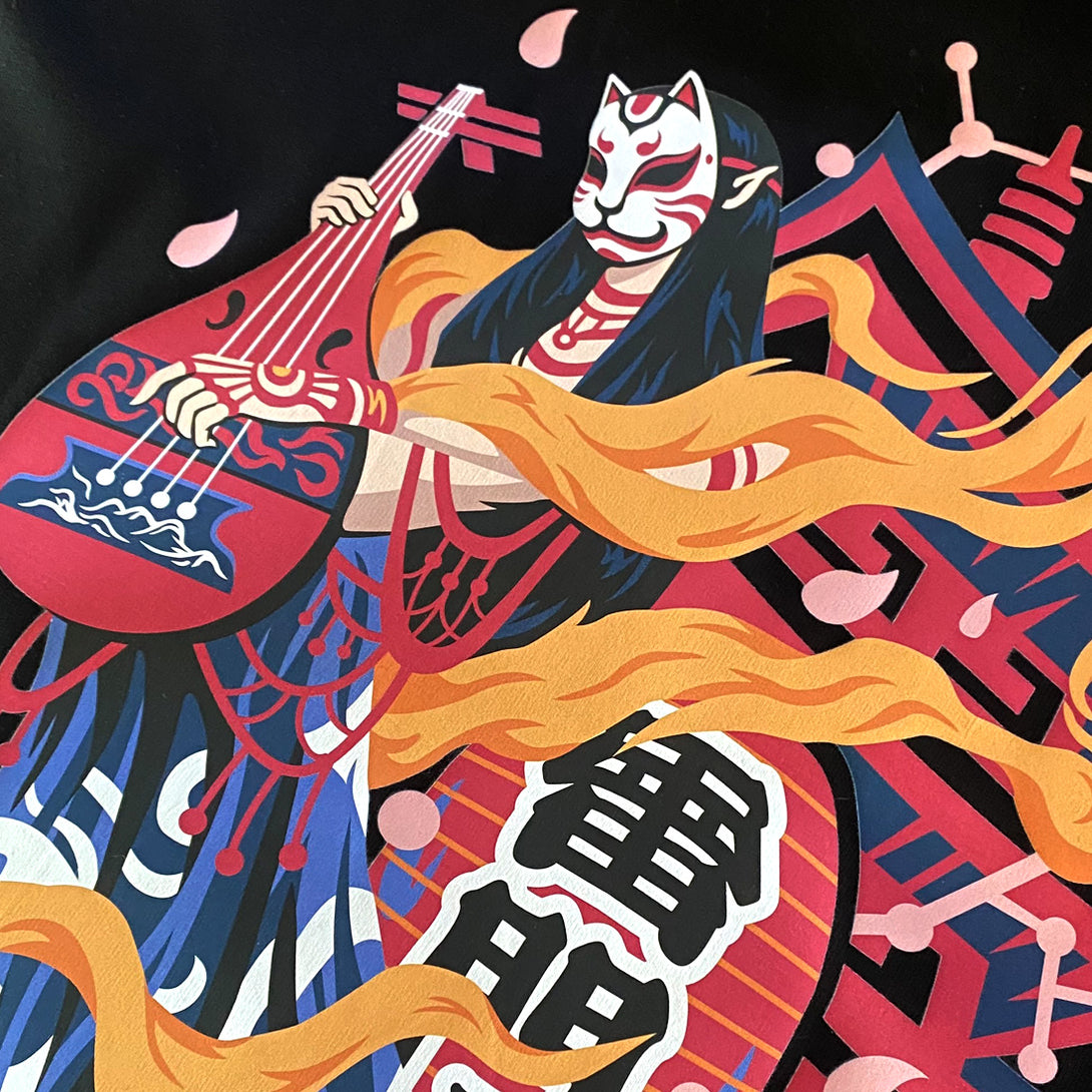 pipa-playing Buddhist semi-deity - a close-up of the design of an oriental buddhist deity playing the pipa, printed on the back of a Japanese style black heavyweight T-shirt-1