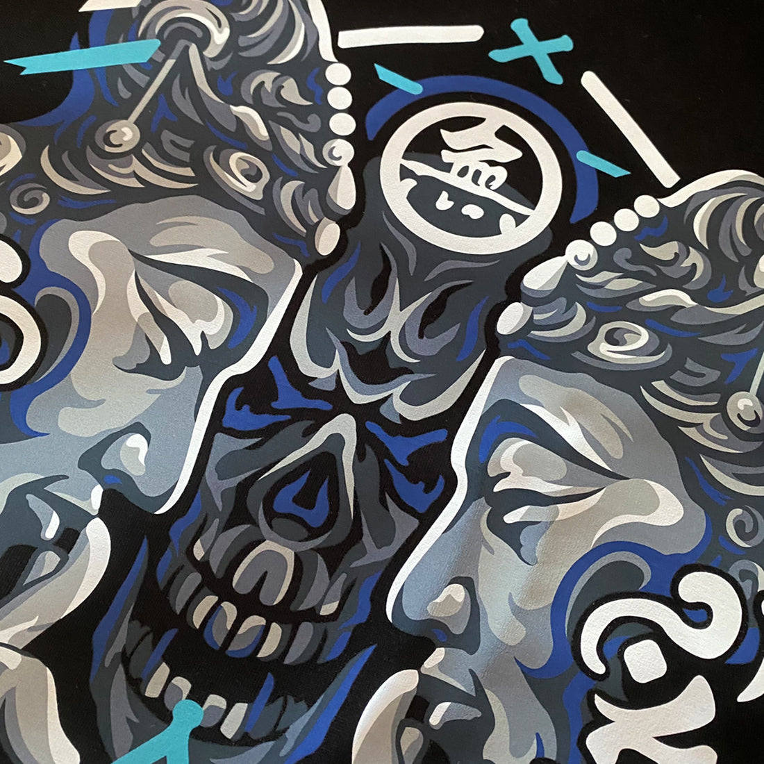 Umarekawari- a close-up of a design of Buddhas confronting the evil illustration printed on the front of a black sweatshirt -1