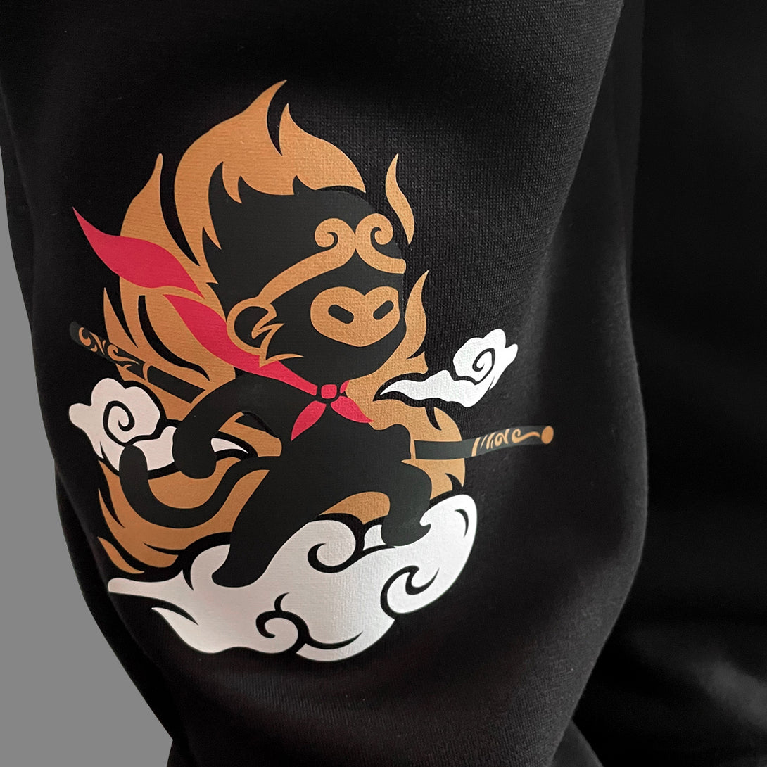 Wukong - a close-up of a minimalist-style Wukong design printed on the Japanese style black sweatpants-1