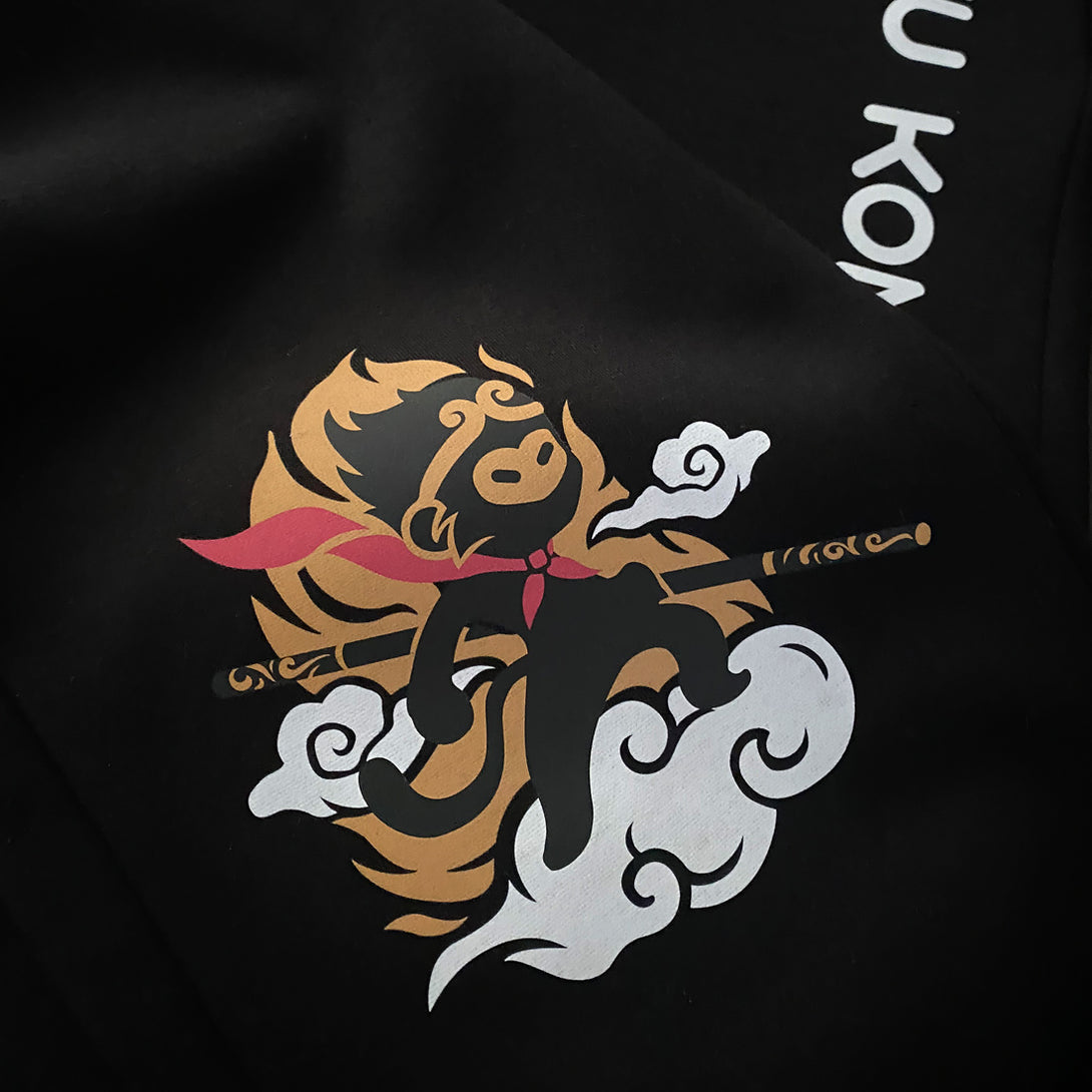 Wukong - a close-up of a minimalist-style Wukong design printed on the Japanese style black sweatpants-2