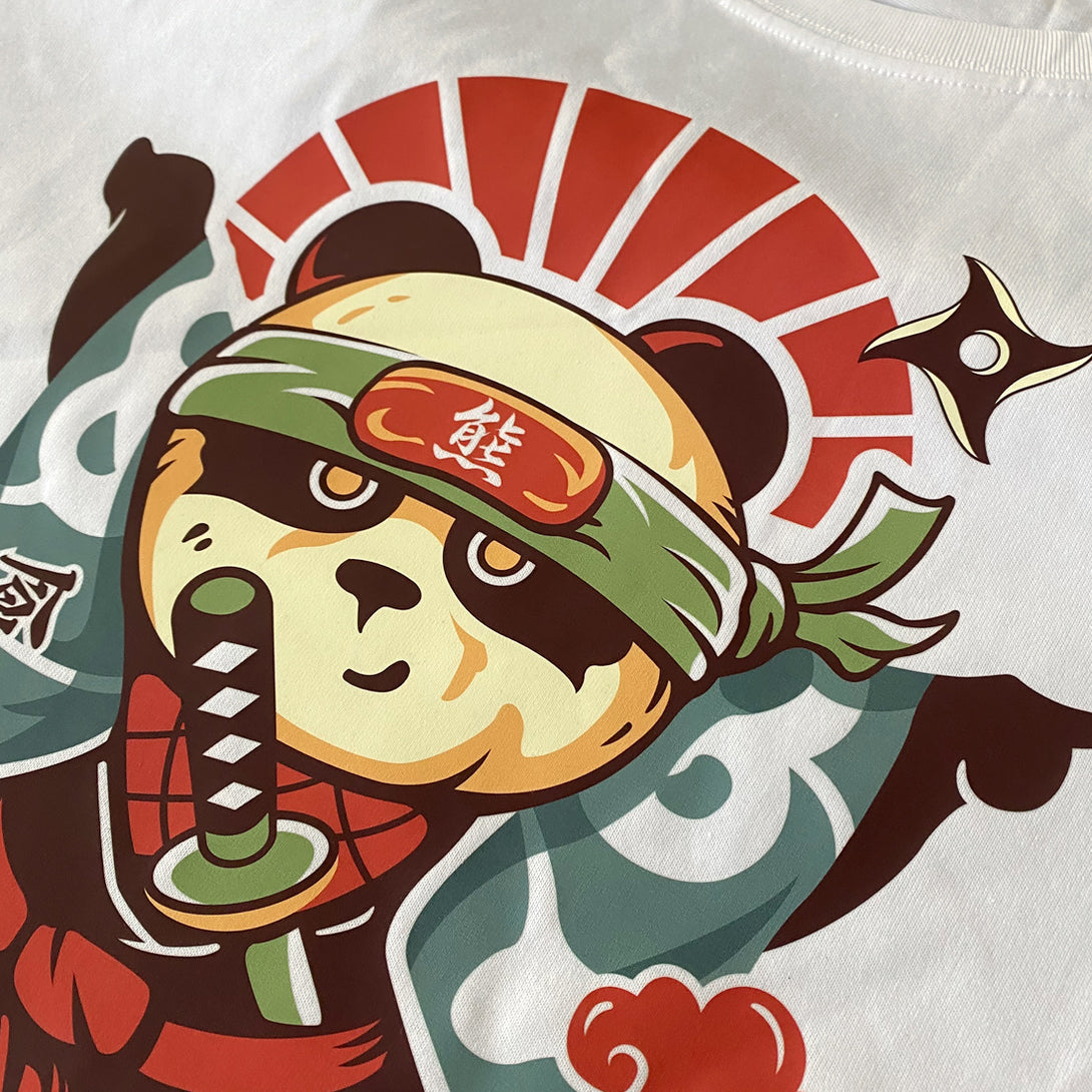 Oversized Ninja - a close-up of an amusing graphic design of an oversized Japanese panda ninja, printed on the Japanese style white heavyweight T-shirt-1