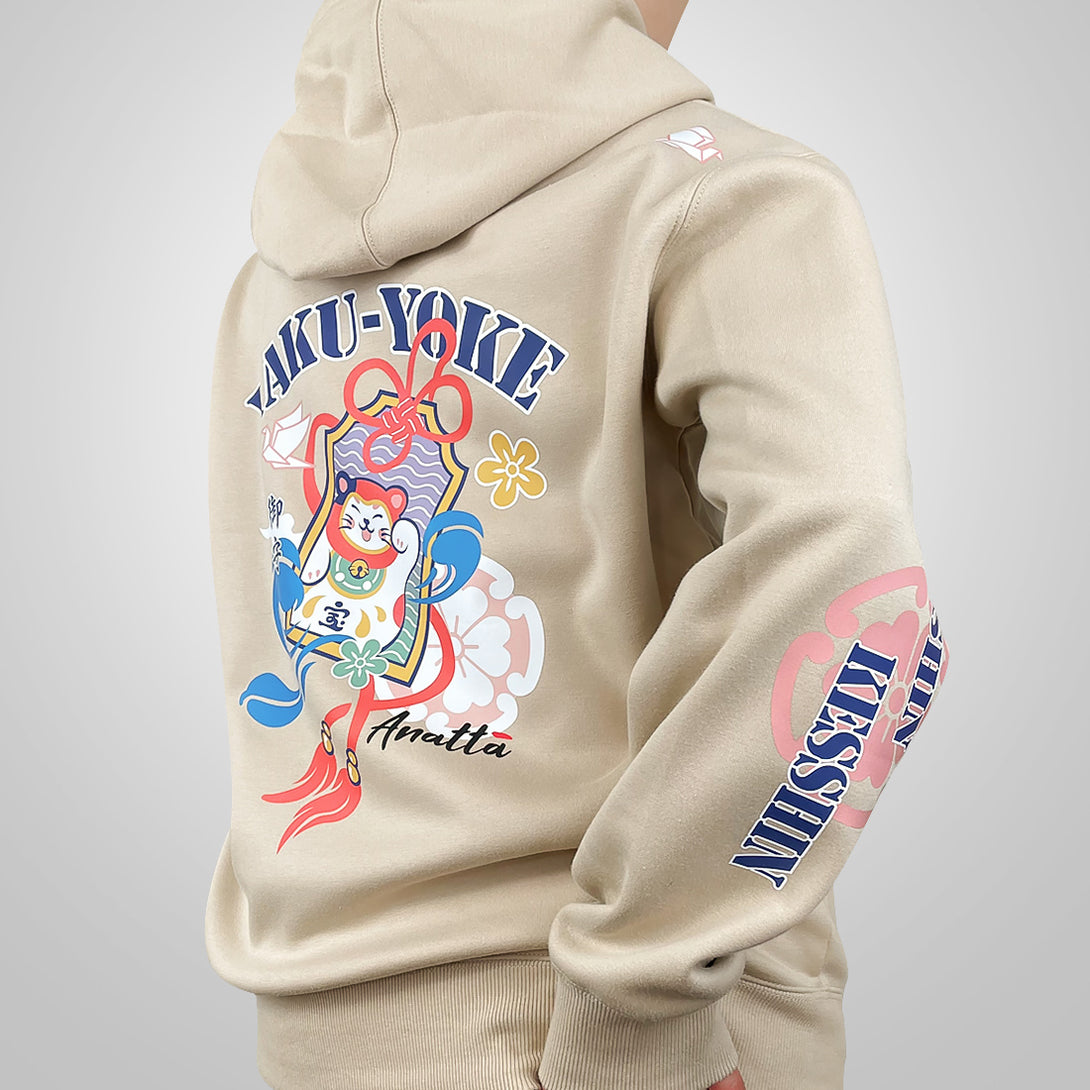 Omamori - a model wearing a khaki hoodie with a brightly colored illustration of a traditional Japanese good luck charm printed on the back-back view-1