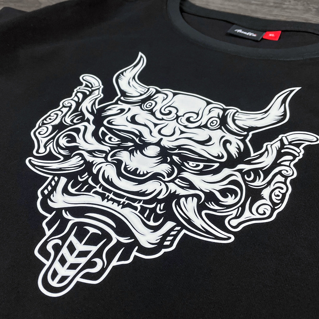 Sins Exist In Human Minds - a close-up of the graphic design inspired by Japanese Oni masks, printed on a Japanese style black heavyweight T-shirt-1